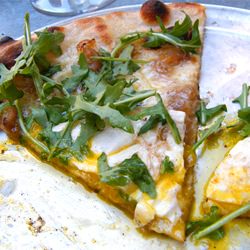 Delicious Egg topped Gruyere Pizza