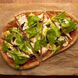 Artichoke, Arugula, and Olive Pizza