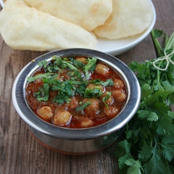 Chickpeas and Puffed Indian Bread