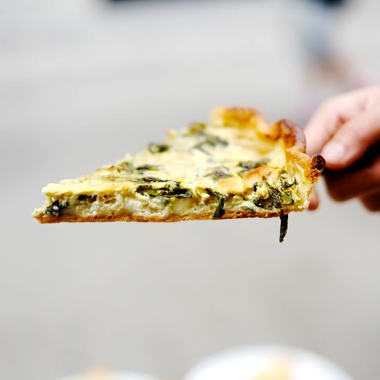 Brie, baby spinach and onion quiche