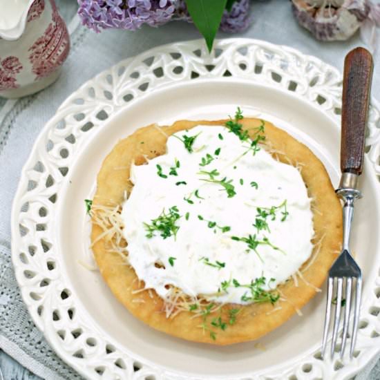 Langos with garlic and goat cheese