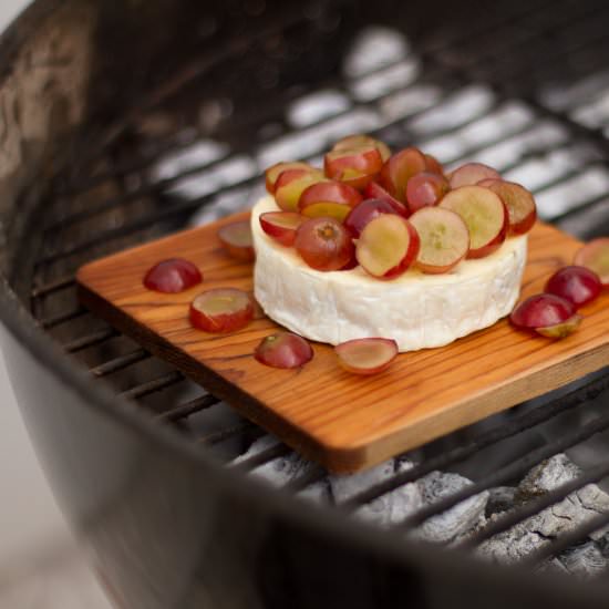 Smoked Brie cheese with Red Grapes