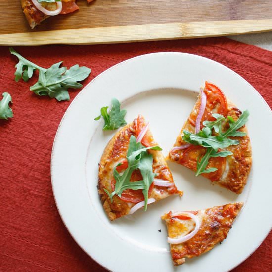 Tomato, Onion and Arugula Pizza