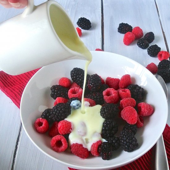 English custard over frozen berries