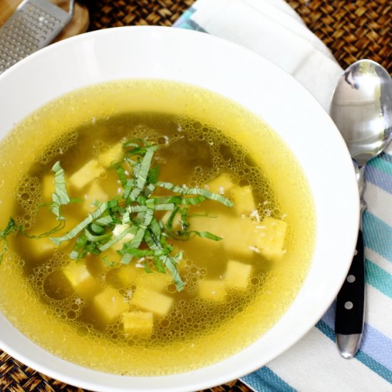 Chicken broth with cheese dumplings