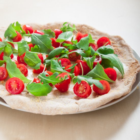 Pizza with rocket and parmesan