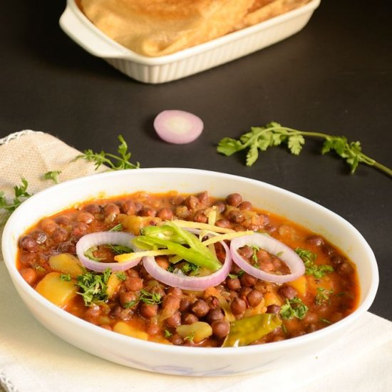 Dry black chickpea and potato curry