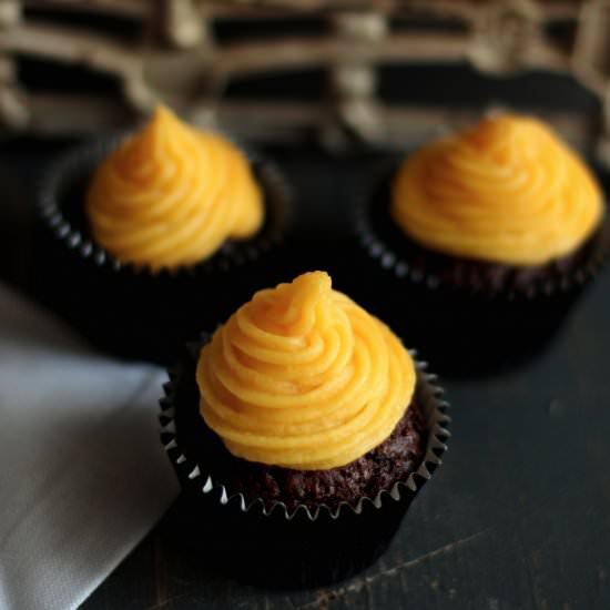 Cocoa cupcakes with mango frosting