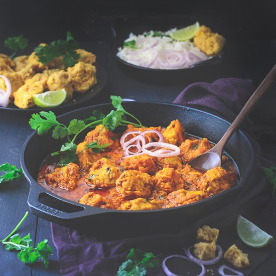 Steamed lentil dumpling curry