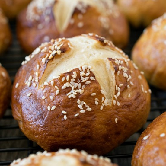 Soft Honey Sesame Pretzel Rolls