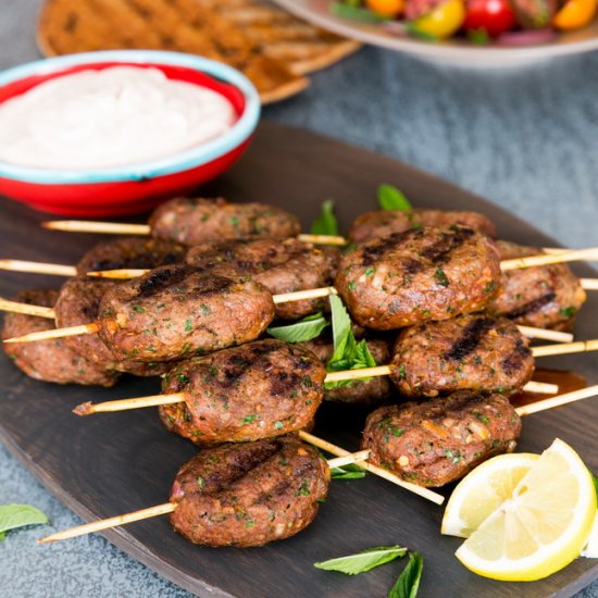 Lamb koftas w/tomato salad, yogurt