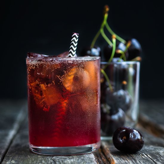 Black cherry bourbon cola smash