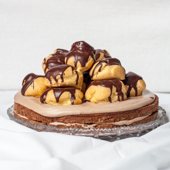 Chocolate cake with cream puffs