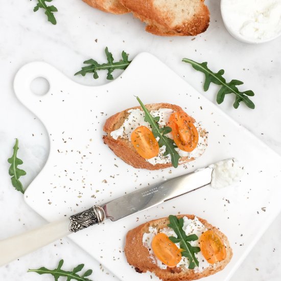 Cream cheese crostini with arugula