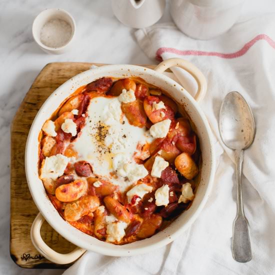 Baked eggs with chorizo and beans