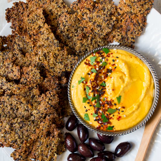 Carrot hummus with quinoa crackers