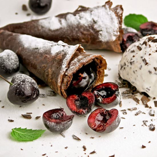 Chocolate crepes with cherries