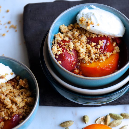 Baked plums with nutty crumble