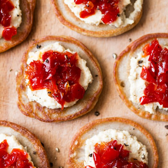 Blinis with red pepper relish