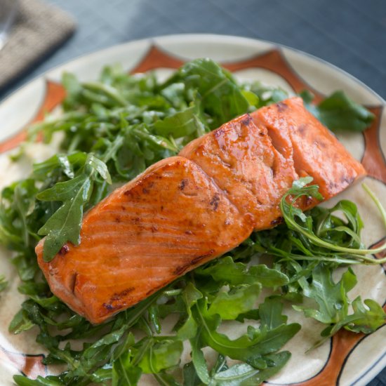 HONEY BALSAMIC SALMON OVER ARUGULA