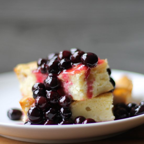 Baked blintzes with blueberry sauce