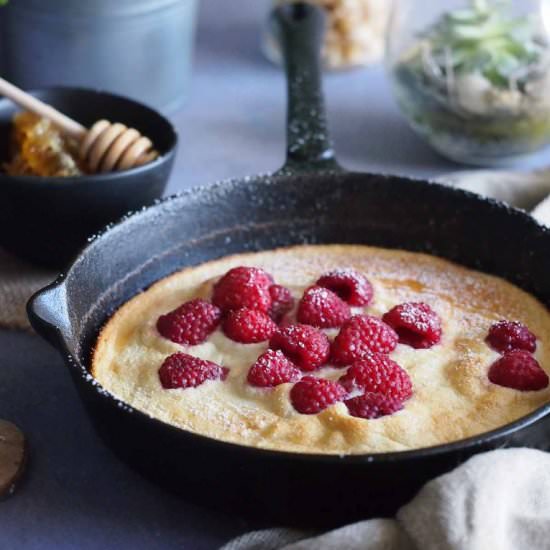 Fluffy honey pancake with raspberry