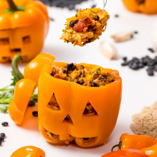 Jack-o’-lantern stuffed peppers