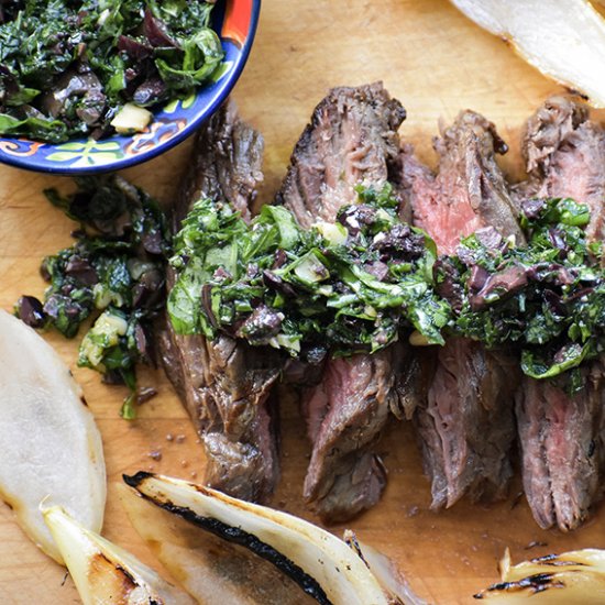 Steak with Olive and Herb Topping