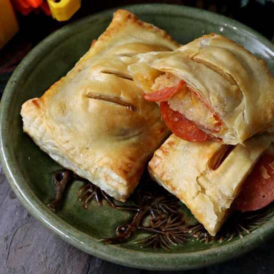 Cheese grits & pepperoni pies