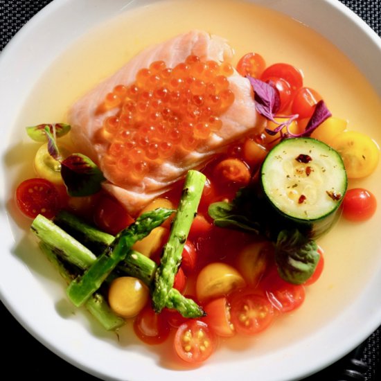 Salmon confit with tomato consommé