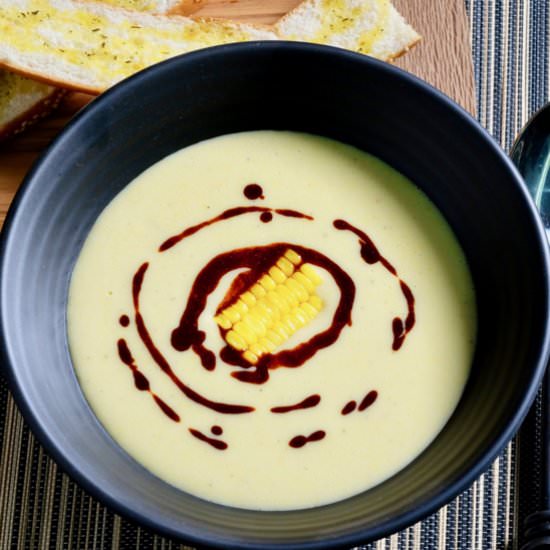 Corn soup with a paprika drizzle