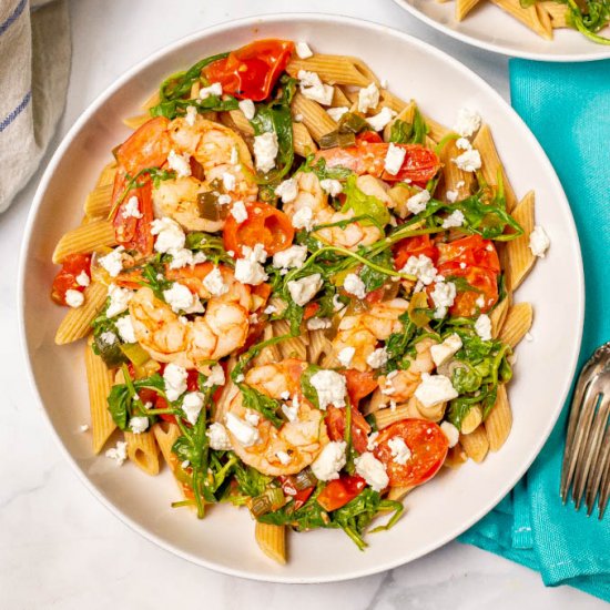 Shrimp and penne pasta with arugula