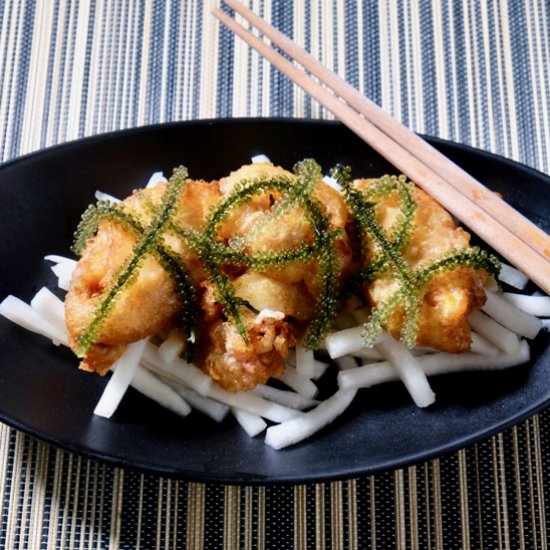 Tempura mussels on pickled daikon