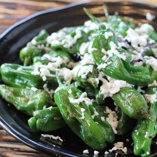 Shishitos with goat cheese and sage