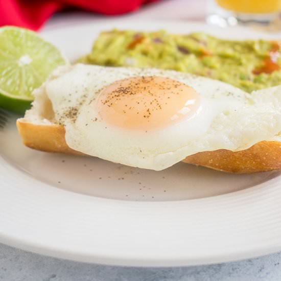 Basted Eggs with Guacamole on Toast