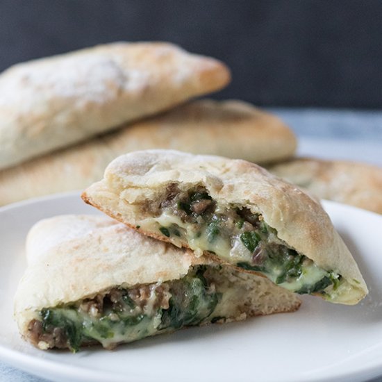 Cheesy Spinach Sausage Calzones