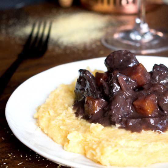 Steak in red wine over polenta