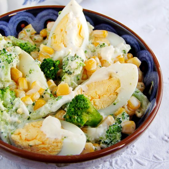 salad with broccoli and an egg