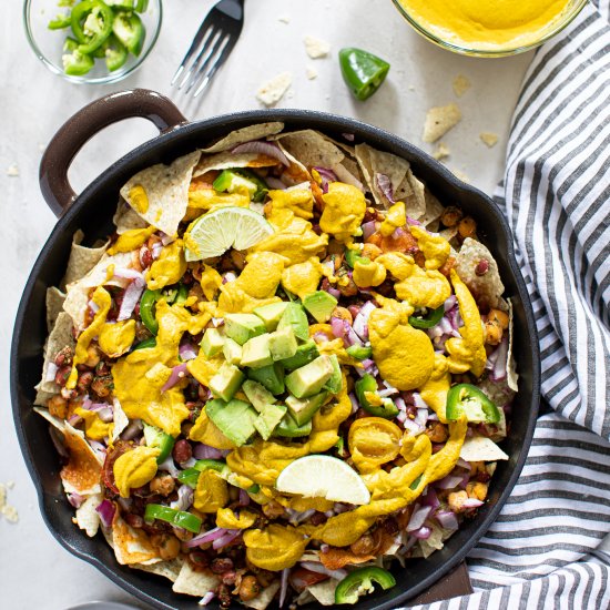 LOADED VEGAN QUESO SKILLET NACHOS