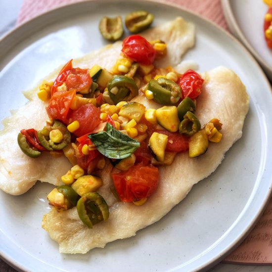 Basa with tomato olive sauce