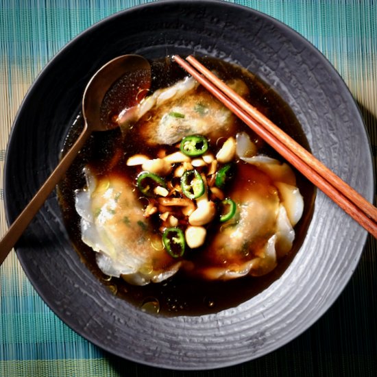 Duck dumplings in mushroom consommé