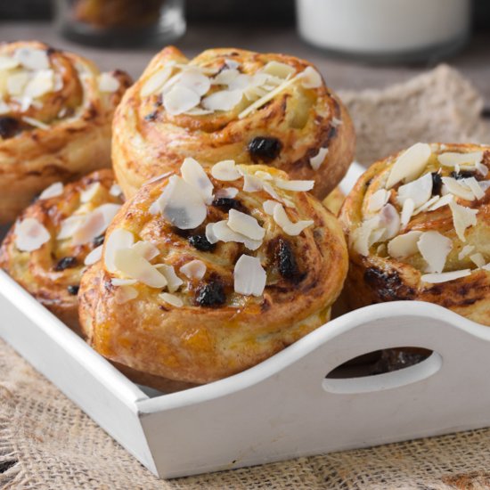 Custard, raisin and almond rolls