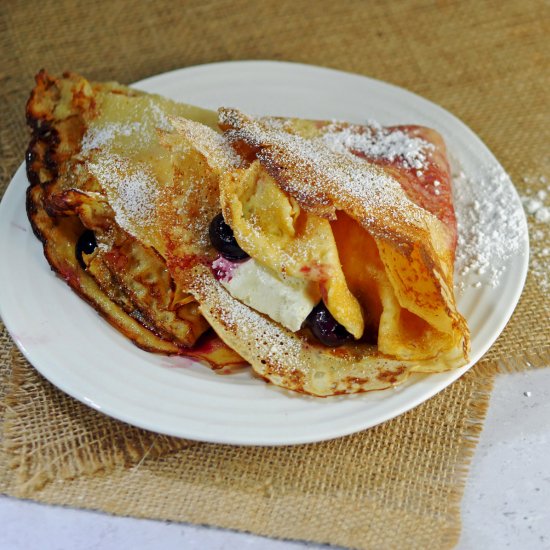 Pancakes with cherries and cream