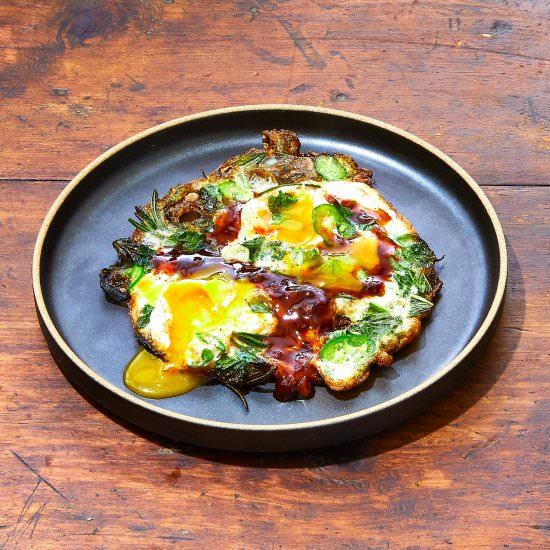 Fried eggs with a ton of herbs