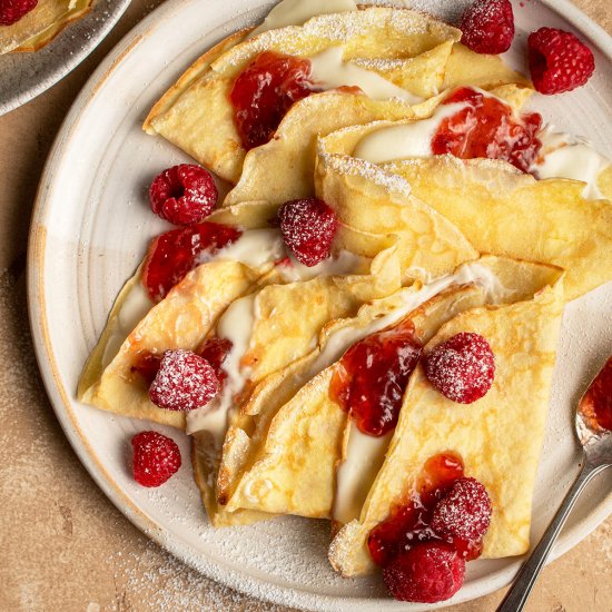 Yuzu crepes with raspberries