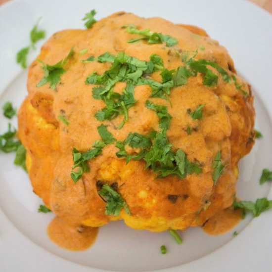 Whole cauliflower in vegan makhani