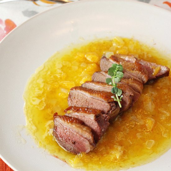 Duck with orange-butter sauce