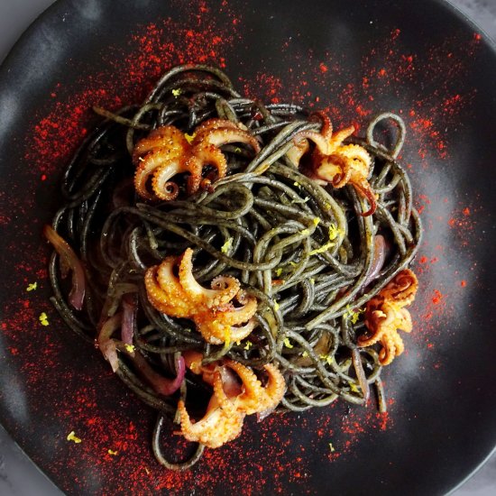 Squid ink pasta with baby squid