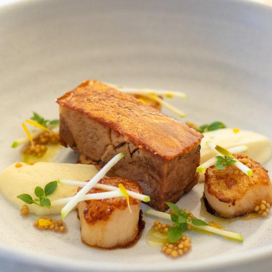 Slow cooked pork with scallops