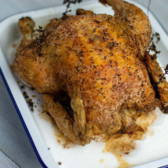 Chicken in herbs roasted in salt